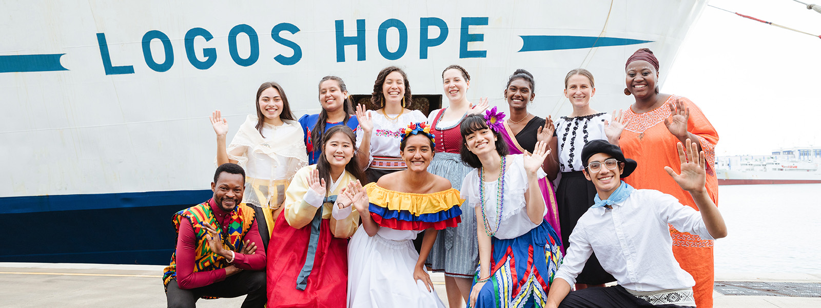 People from around the world standing in front of Logos Hope