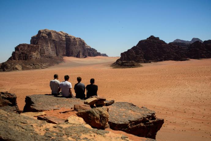 Four young men in the desert