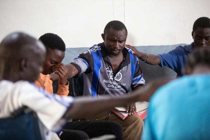 Team praying at the school for the disabled in Zambia