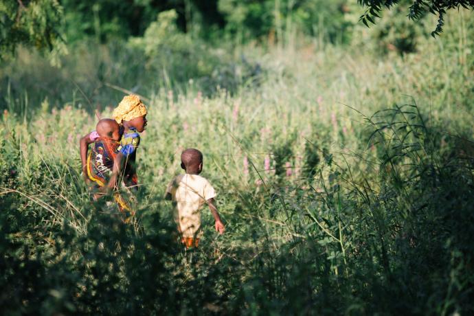 kids walking through African landscape
