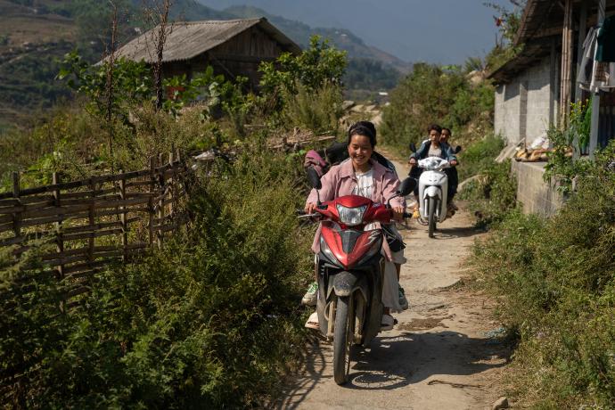 Mekong woman riding motorcycle
