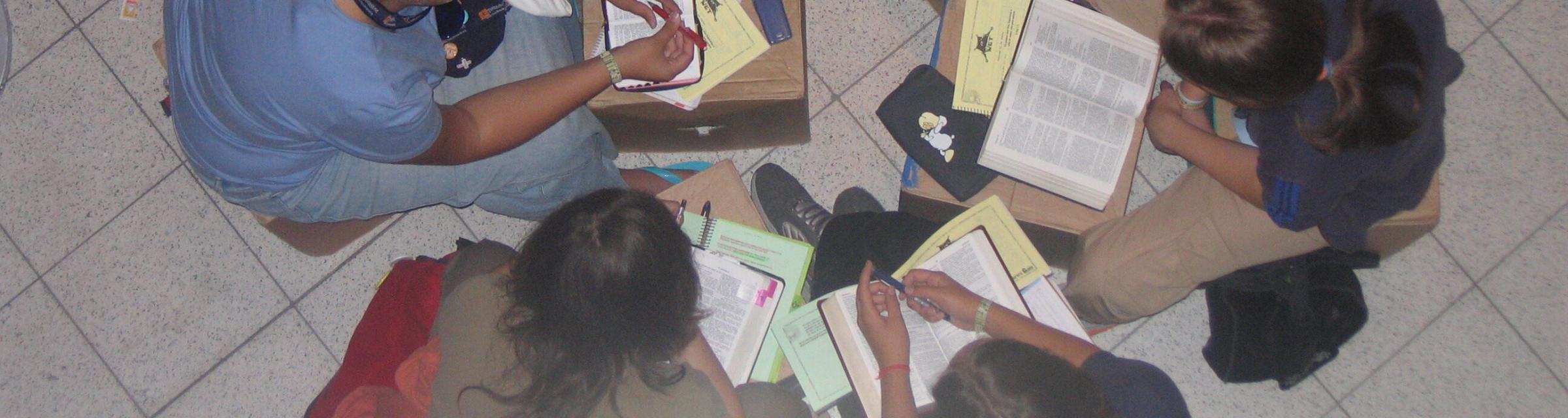 A small group (NET group) at TeenStreet Germany 2005. This group of teenagers with their leader (coach) are studying the bible together.