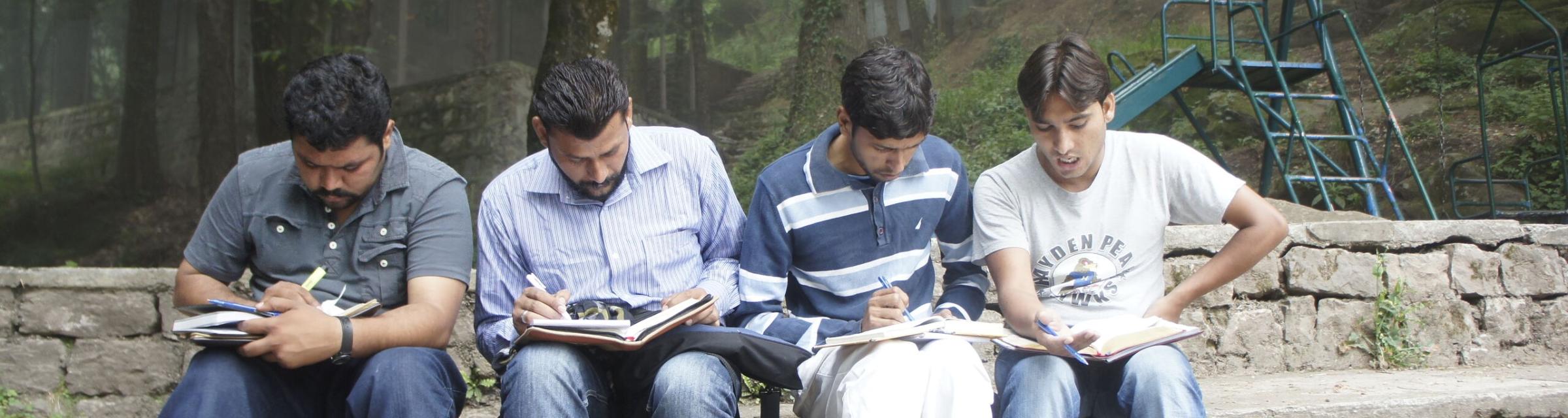 Studying the Bible together in Pakistan.