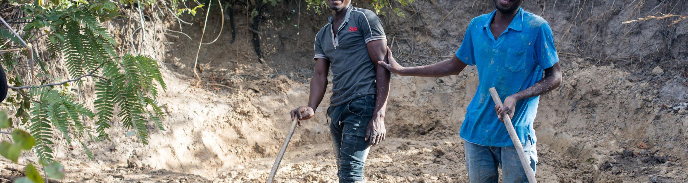 OMer John (right) with one of his disciples as they work the ground to make bricks.