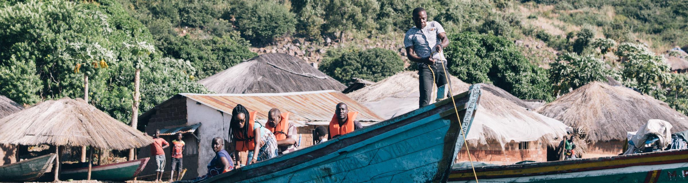 Lake Tanganyika missionaries travelling on a boat to different villages.