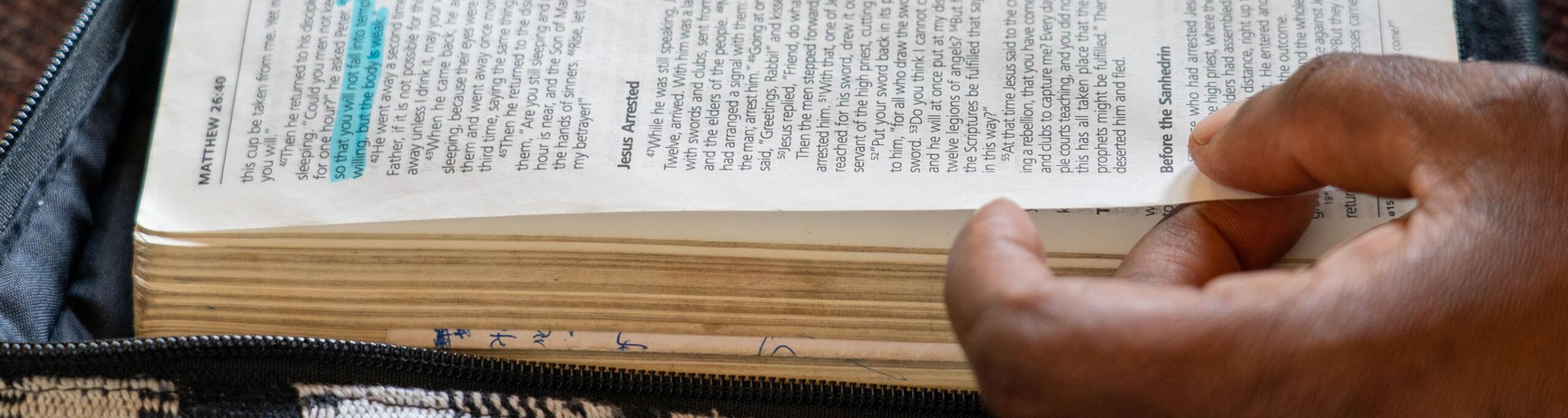 People page through the Bible. Photo by RJ Rempel.
