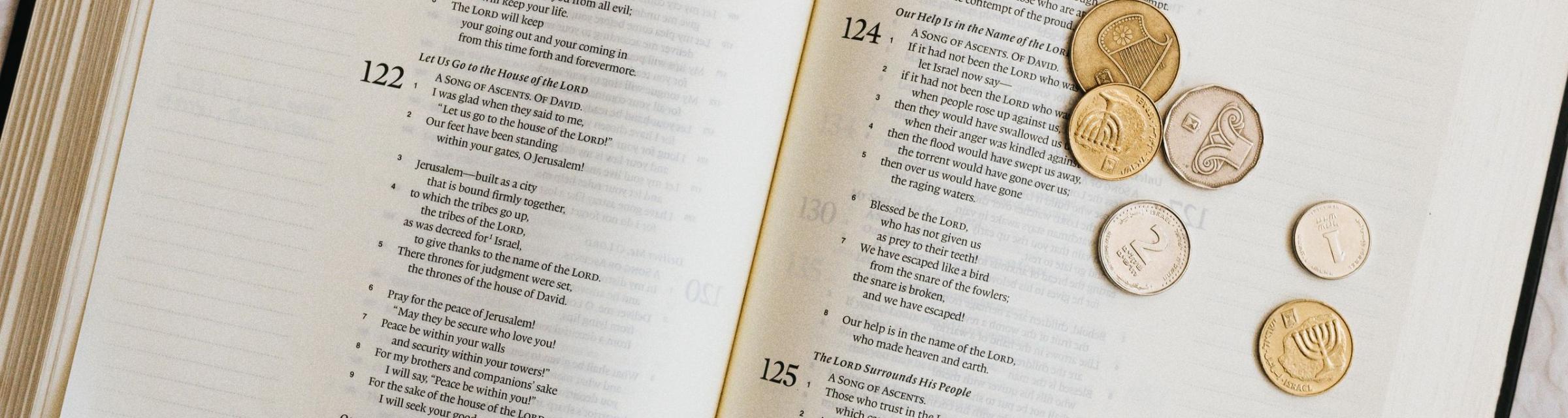Shekels on a Bible by Sara Beth Pritchard.