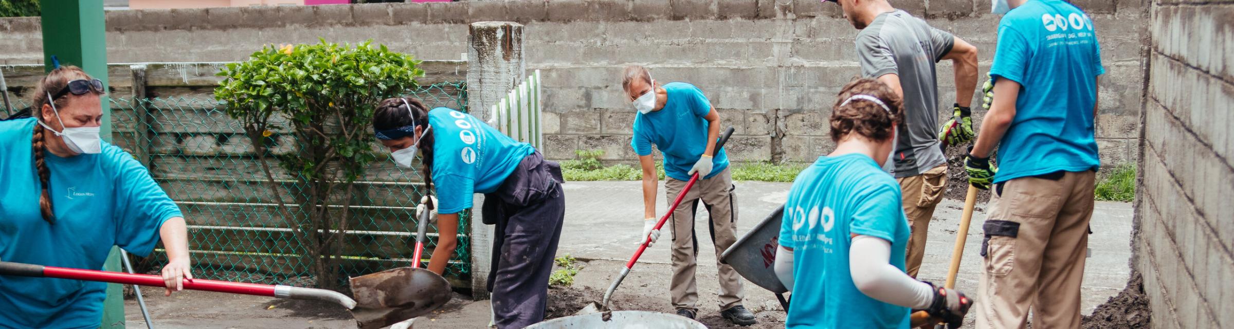 Kingstown, Saint Vincent and the Grenadines :: A Logos Hope team helps to clear ash left by the volcanic eruptions.