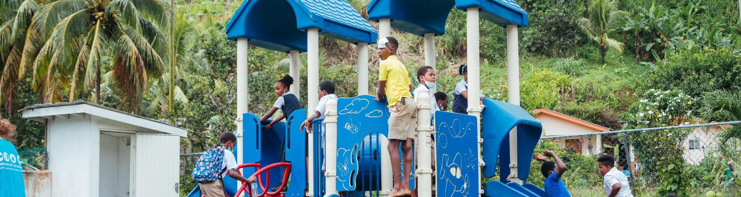 Kingstown, Saint Vincent and the Grenadines :: Children using a playground donated from the USA and assembled in the town of Mesopotamia by Logos Hope's crewmembers.