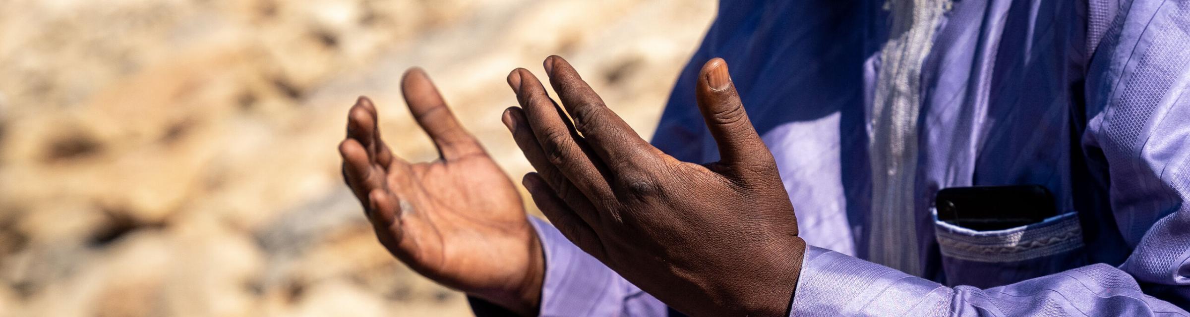 A man from the Sahel prays for his country. Photo by RJ Rempel.