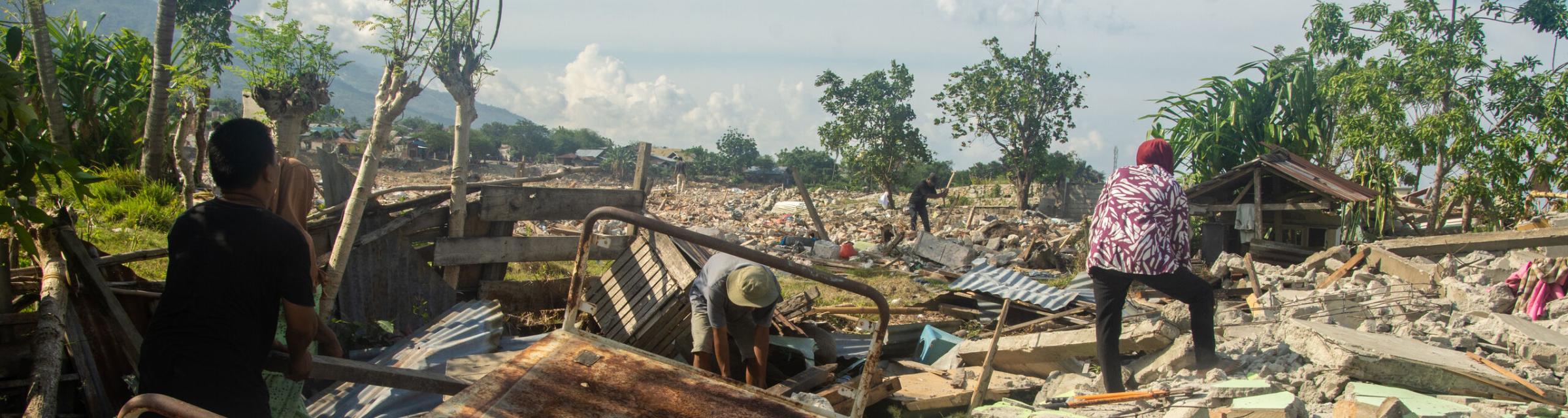 In 2018, an earthquake off the coast of Indonesia caused a tsunami that wreaked havoc on the coastline. The city of Palu was the worst hit. Families had to sort through piles of their things that had been swept away or damaged. Photo by Ellyn Schellenberg