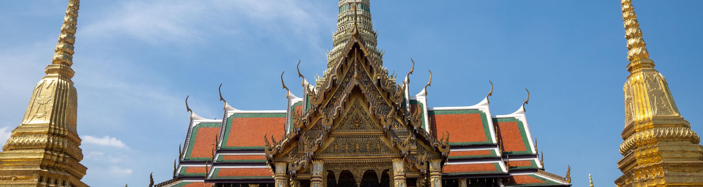 Tourists visit the temple complex at The Grand Palace in Bangkok, Thailand. Photo by RJ Rempel.