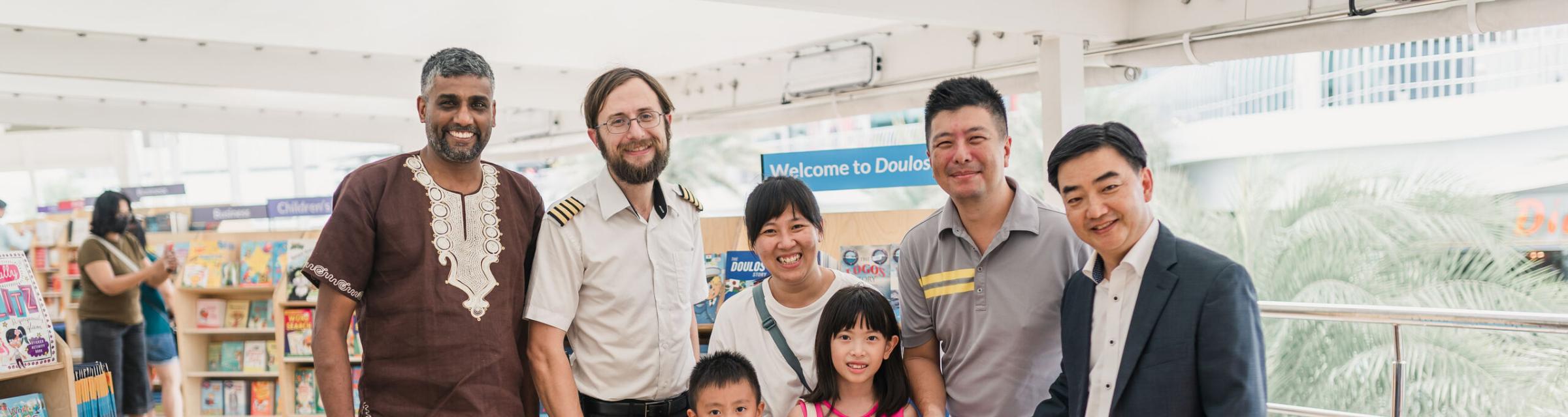 Singapore, Singapore :: Managing Director Pil-Hun Park (Korea) welcomes the first visitors to Doulos Hope's bookfair, alongside Captain James Berry (UK) and CEO, Seelan Govender (South Africa).