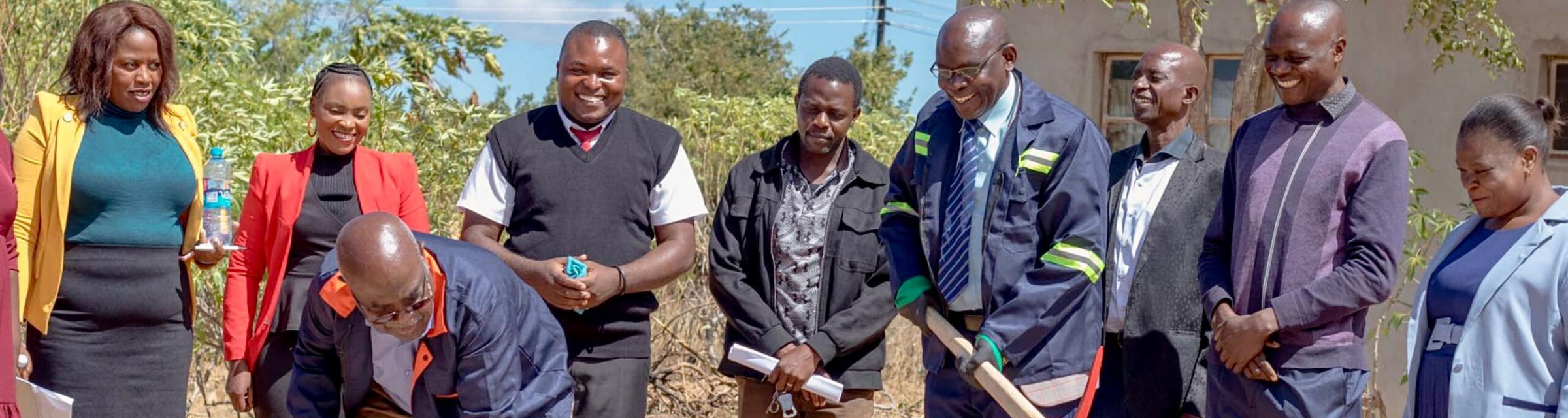 Breaking ground for a protective wall at Makwati School in Zambia, built and run by OM in Zambia. The wall will protect the school from theft and vandalism, while also allowing the school to keep small livestock.