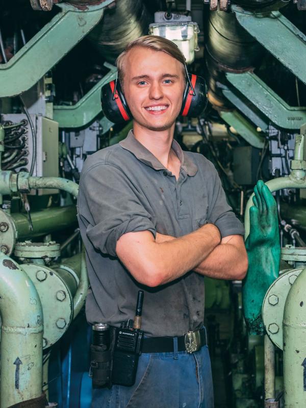 portrait of a young man in engine room onboard the Logos Hope