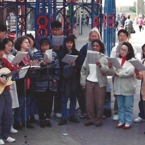 people singing in street