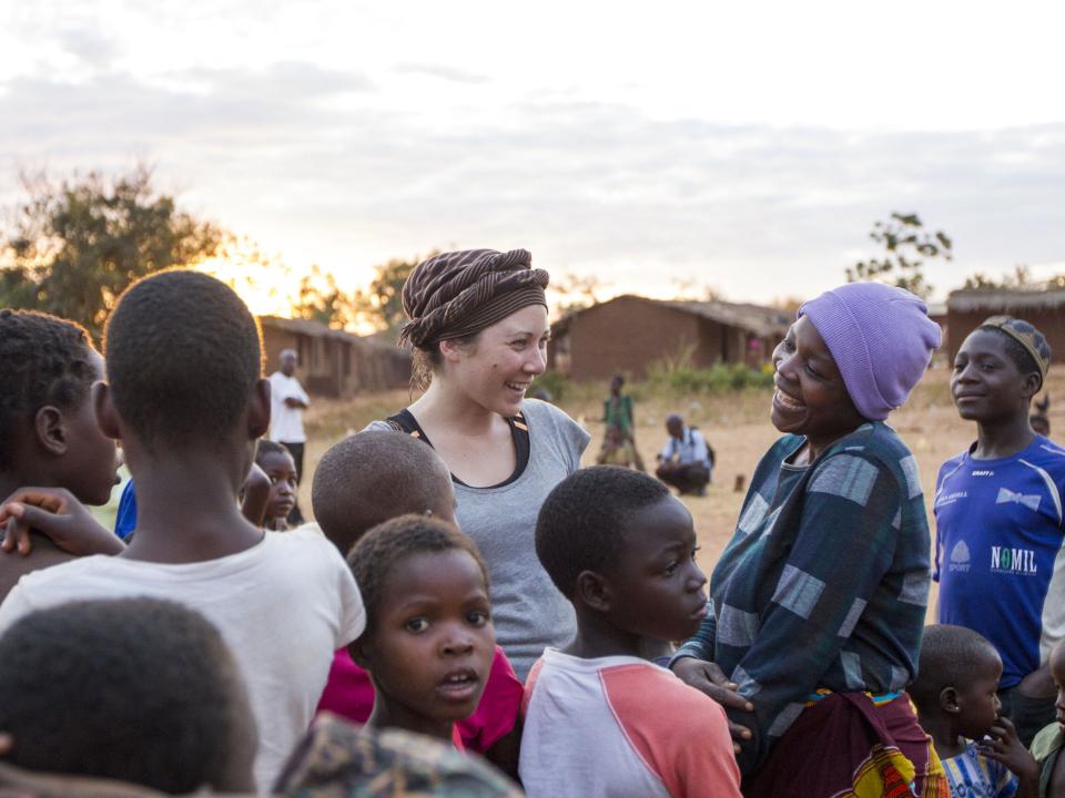 Young woman with villagers in Malawi