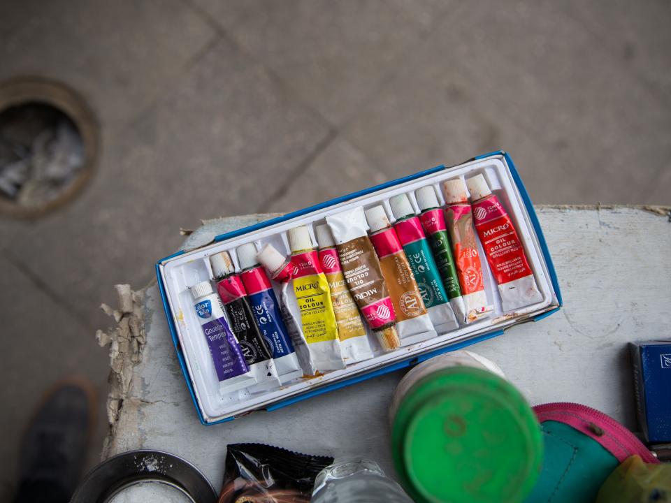 Artist paints alongside fellow artists in the public square.  Photo by Jacob Carter