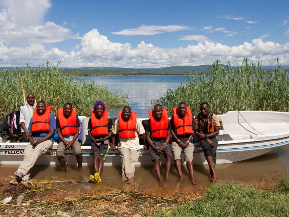 A team travels by boat to an island along Lake Tanganyika for outreach.