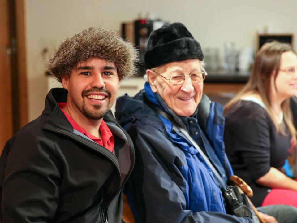 Steve, a member of the Hope for Zurich-team, connects with an elderly man after the Bible study at a local church. Photo by Anja B.