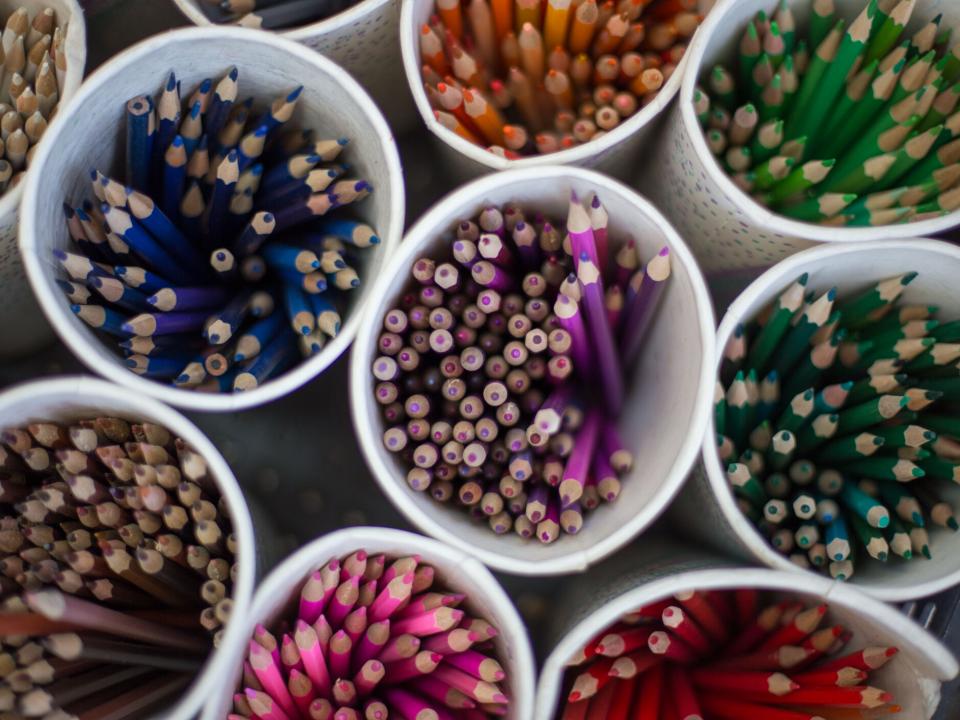 Pots of coloured pencils stand ready for use in an MK school in Central Asia.