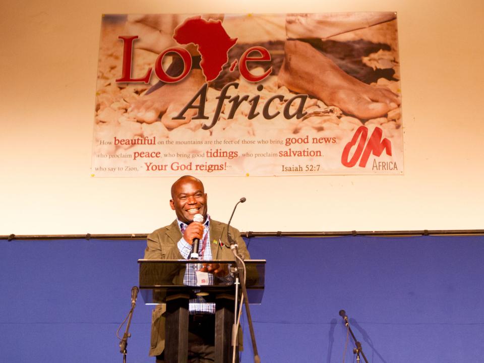 Africa Area leader Pastor Melvin Chiombe speaks at Love Africa in Kabwe, Zambia.