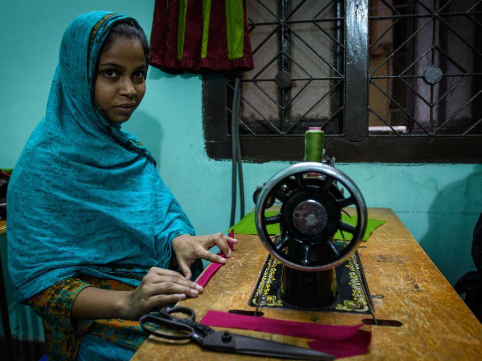 Young women living in a slum in Bangladesh have the opportunity to learn a technical skill like sewing, enabling them to earn a living. Photo by Garrett N