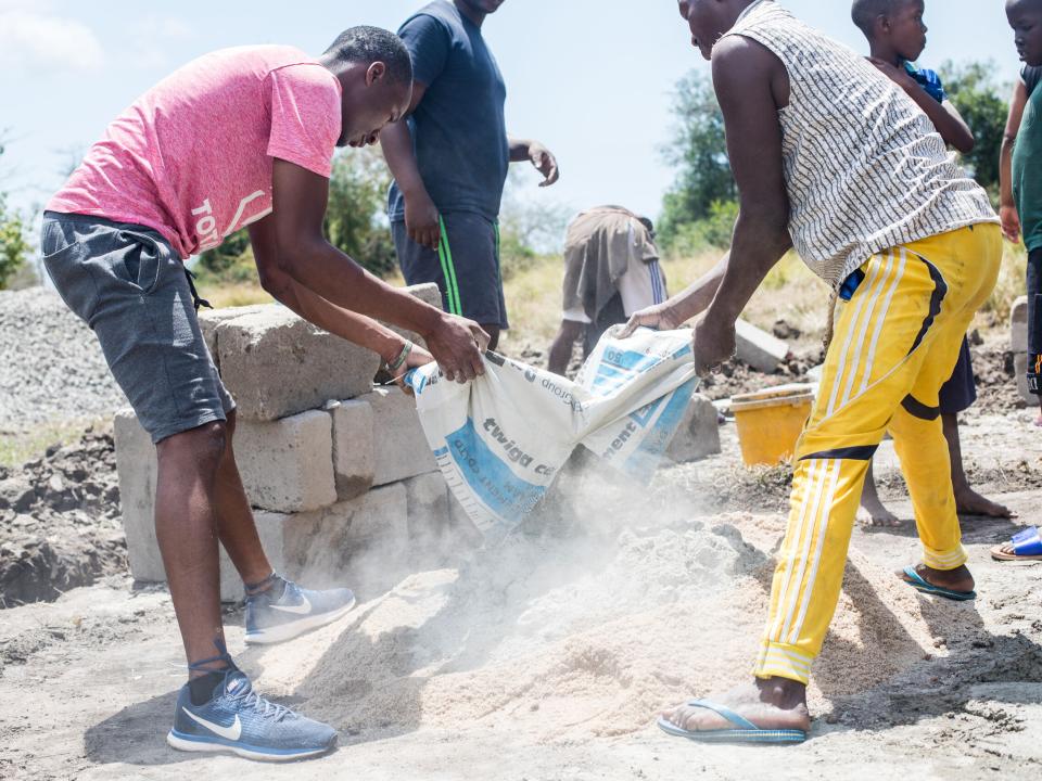 An outreach works to build a church in Matipwili, a village in Tanzania.