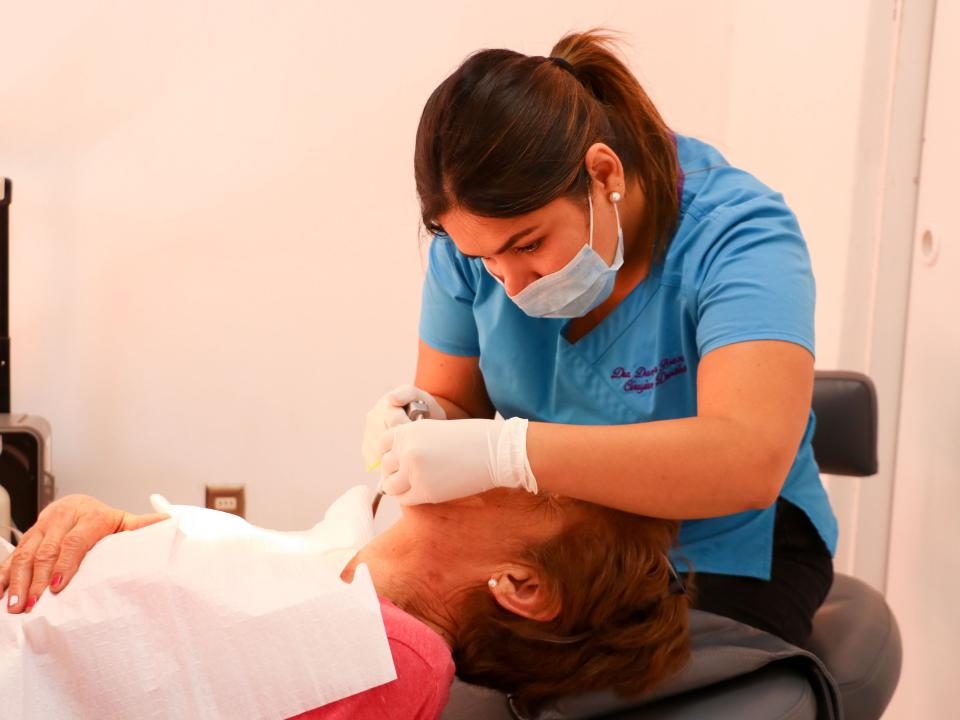 Antofagasta, Chile :: Alongside crewmembers from Logos Hope, a dentist gives free dental care to a community.