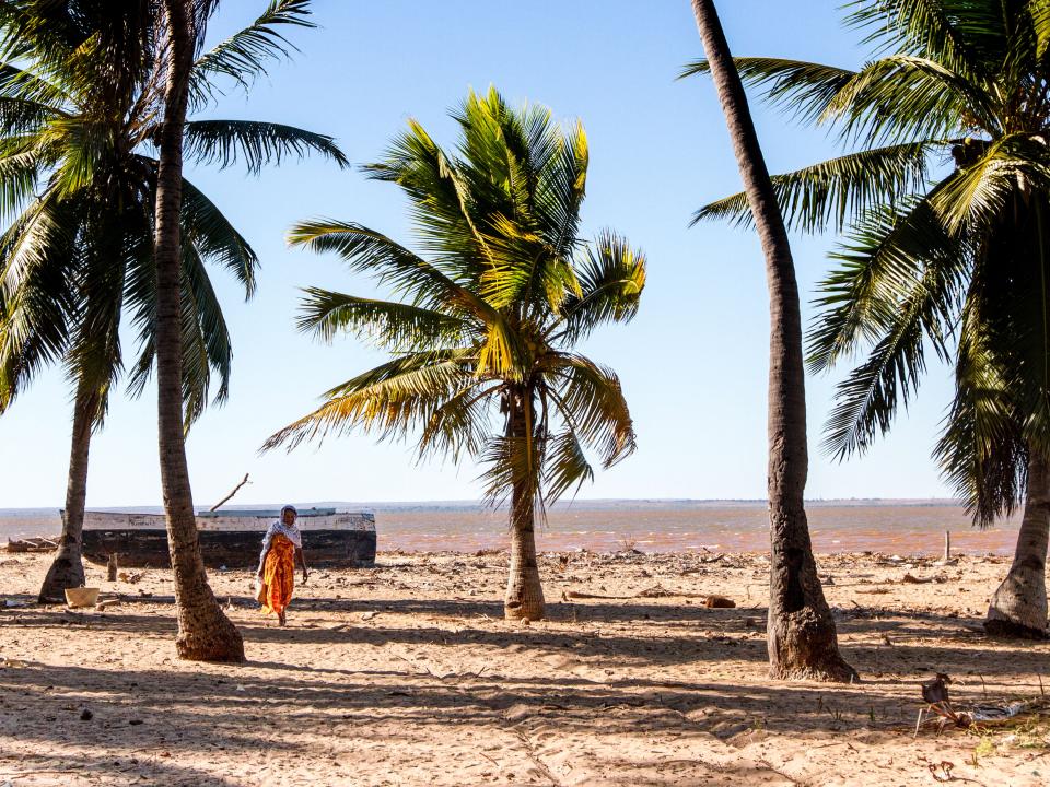 A woman walks along the beach in northern Madagascar. Photo by Rebecca Rempel.