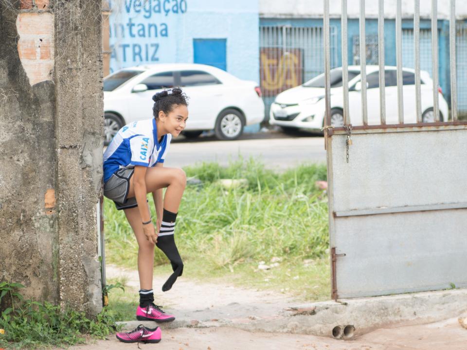 Belém, Brazil :: A girl from an underprivileged area of Belém puts on her shoes.