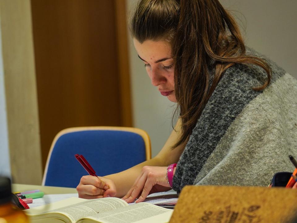 A Mission Discipleship Training (MDT) Love Europe student takes notes during a training session. Photo by Achim Schneider.