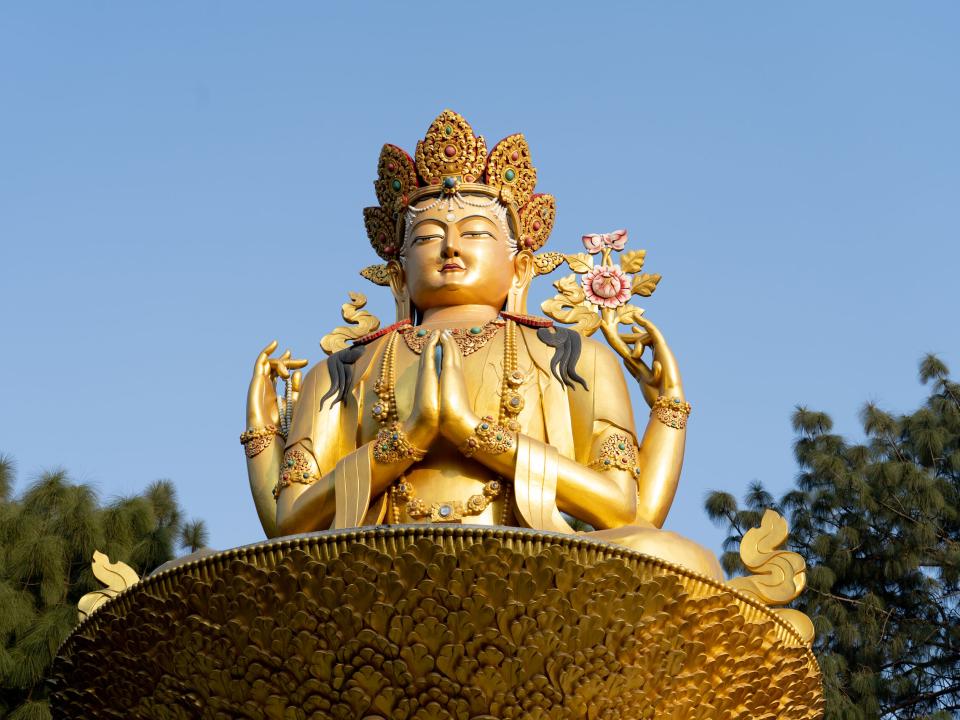 Statue outside of a Buddhist temple in South Asia. Photo by Rebecca Rempel.