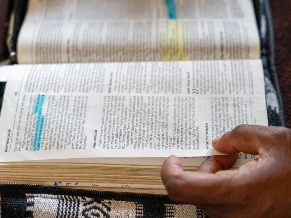 People page through the Bible. Photo by Rebecca Rempel.