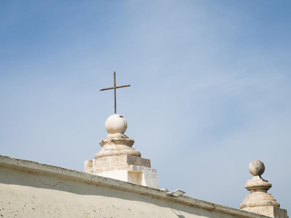 A cross on top of a church. Photo by Rebecca Rempel.