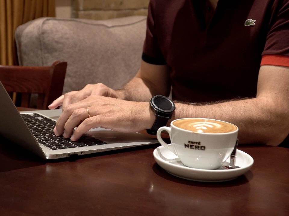 A marketplace worker spends the afternoon doing his job remotely from a local coffee shop. Photo by Jay S.