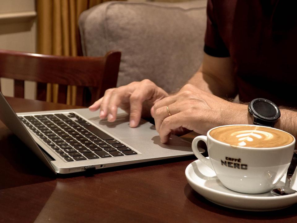 A marketplace worker spends the afternoon doing his job remotely at a local coffee shop. Photo by Jay S.