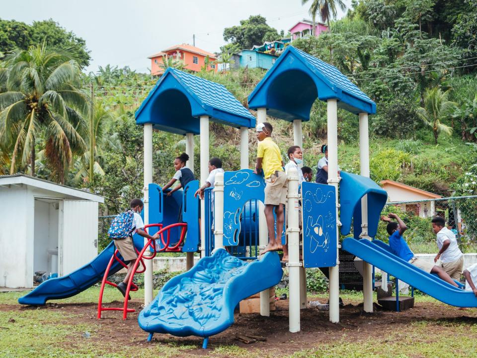 Kingstown, Saint Vincent and the Grenadines :: Children using a playground donated from the USA and assembled in the town of Mesopotamia by Logos Hope's crewmembers.