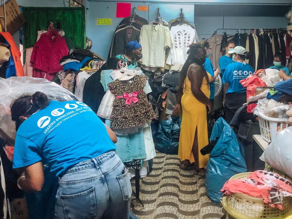 Castries, Saint Lucia :: Crew help to sort donated clothes at a Salvation Army thrift shop.