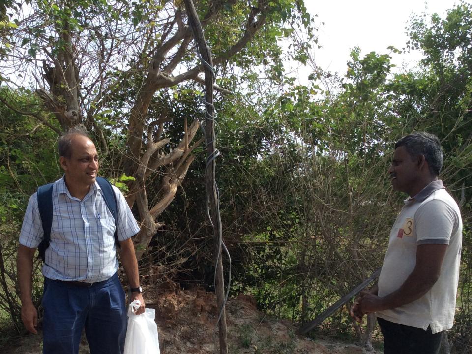 George (left) visits a newly constructed tube well in Sri Lanka with a local pastor. The well was built for a widow in need of clean drinking water close to her home.