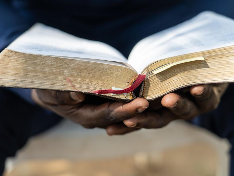 A man reads the Bible. Photo by Rebecca Rempel.