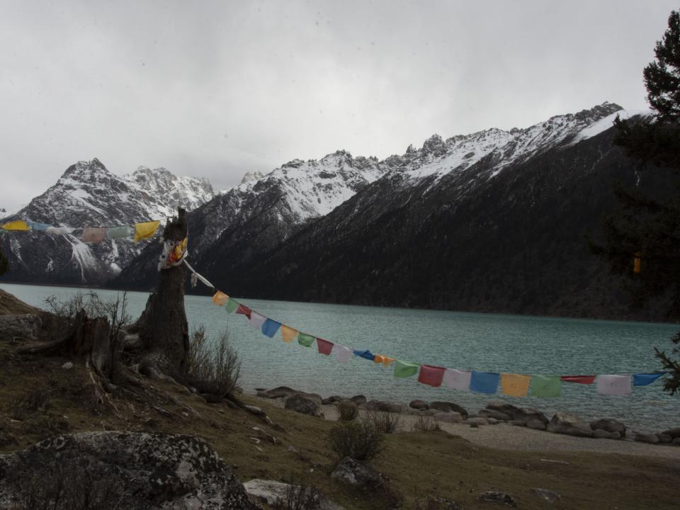 Tibetans live across the Himalayan range in South Asia. A common feature in Tibetan Buddhism are the colorful prayer flags which are often found along trails and mountain peaks. Photo by Ellyn Schellenberg.