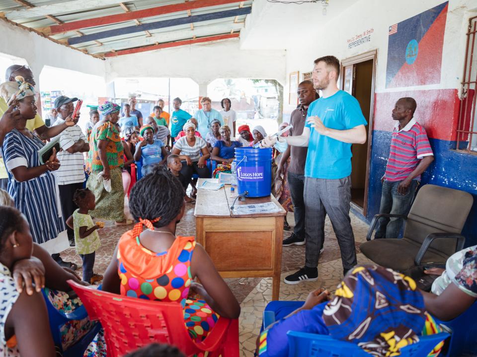 Monrovia, Liberia :: Jan Streitenberger (Germany) explains how to use the water purifiers donated by Logos Hope.