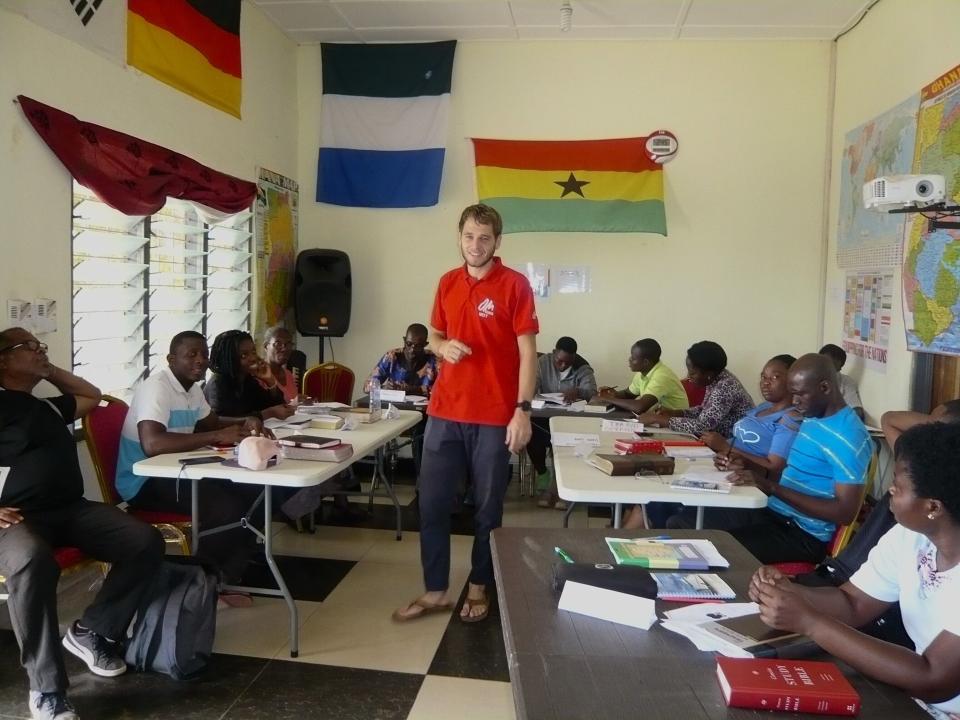REACH participants being trained in a classroom.
