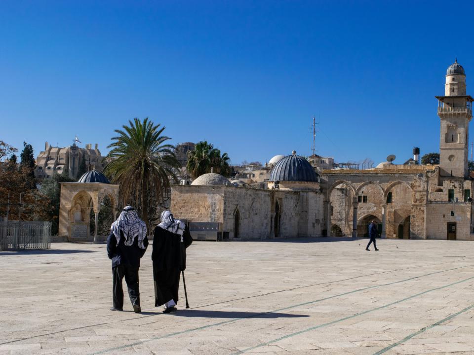 Arab men walking at Dome of the Rock. Photo by Kate Toretti.
