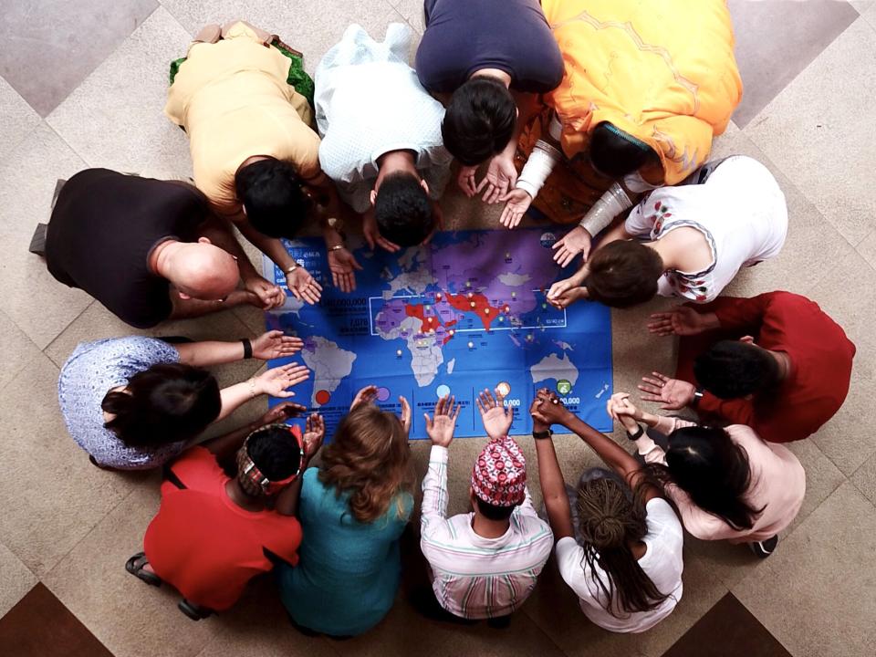 A group of OMers praying for the nations of the world.