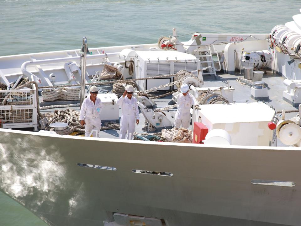 Penang, Malaysia :: Crewmembers (previously from The Taipan) wave during a Doulos Hope sea trial