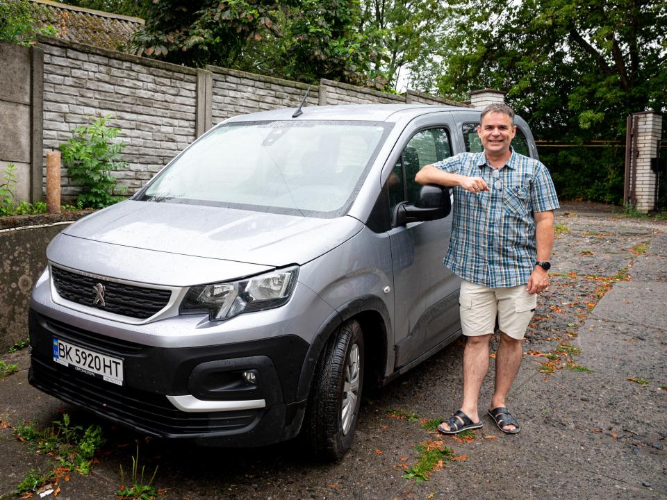 Stefan with a van purchased for him and the team.