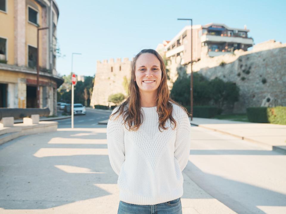 Vlorë, Albania :: Katie smiles in the sunlit streets of Vlorë during a ship visit there