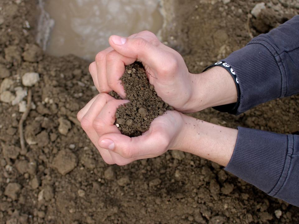 Hearts formed out of dirt during an outreach.